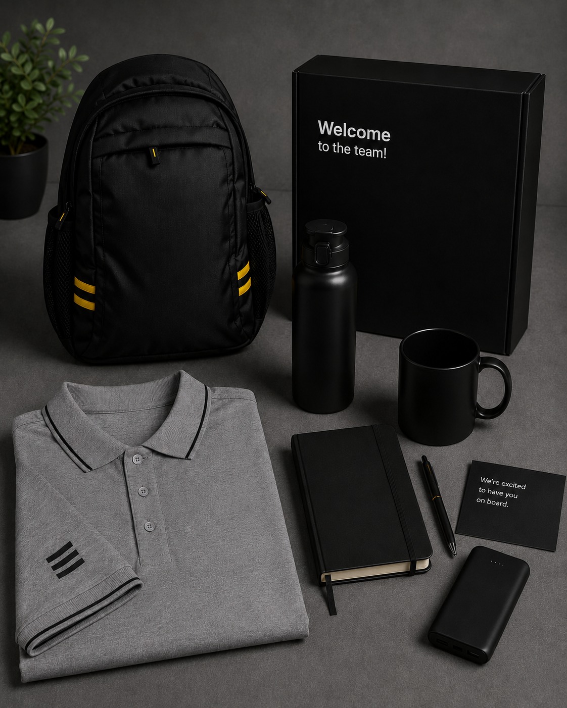 Premium black employee onboarding welcome kit with backpack, bottle and polo