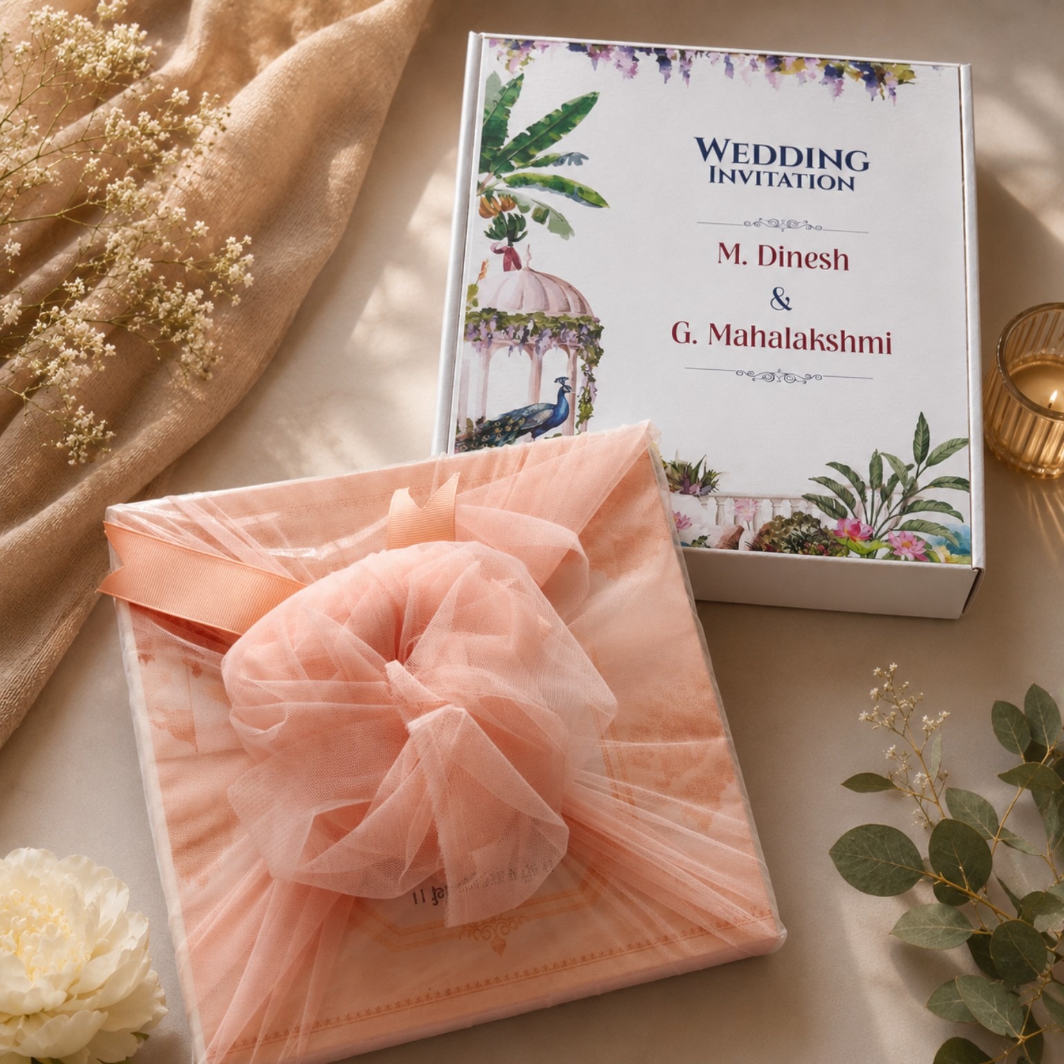 Wedding invitation gift box wrapped in peach tulle